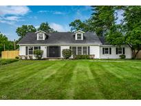 Charming exterior view of this inviting single-Gathering home with manicured lawn and double door entrance at 8888 Cholla Rd, Indianapolis, IN 46240