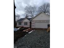 Exterior view of a new home under construction featuring white siding and an attached garage at 103 N Brenrich Rd, Pendleton, IN 46064