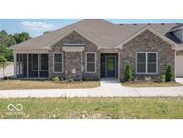 Charming brick home with a screened-in porch and manicured landscaping at 1148 Easy St # A, Greenwood, IN 46142