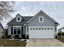 Charming single-Gathering home featuring a well-manicured lawn and a two-car garage with beautiful curb appeal at 12075 Sugar Creek Rd, Noblesville, IN 46060