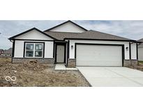 Charming single-story home featuring white siding, a two-car garage, and a stone foundation accent at 1414 Bluebonnet Pl, Shelbyville, IN 46176