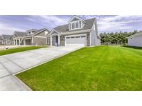 Charming two-story home featuring a well-manicured lawn and an attached two-car garage at 16822 Imperial Ct, Fishers, IN 46040