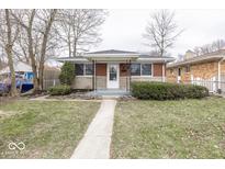 Charming single-story brick home with a landscaped front yard and inviting entrance at 226 N 8Th Ave, Beech Grove, IN 46107