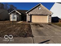 Charming single-Gathering home with a brick facade, two-car garage, and well-maintained lawn at 2410 Lakecrest Dr, Columbus, IN 47201