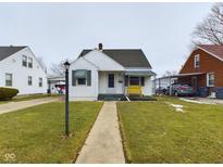 Charming single-story home with well-maintained lawn and covered entry, providing a welcoming curb appeal at 3016 Sheridan St, Anderson, IN 46016
