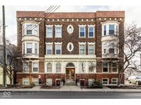 Three story brick apartment building with decorative architectural details at 643 Fort Wayne Ave # B & D, Indianapolis, IN 46204
