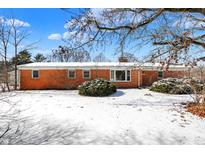 Charming brick home with a cozy, well-maintained exterior and snowy front yard at 6838 Hague Rd, Indianapolis, IN 46256