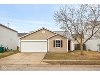 Charming single-story home featuring a two-car garage and low-maintenance landscaping at 13332 N Brick Chapel Dr, Camby, IN 46113