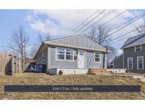 Charming single-story home with a well-maintained lawn and inviting front porch at 1420 E Market St, Indianapolis, IN 46201