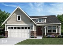 Charming single-Gathering home featuring a two-car garage, stone accents, and a well-manicured front lawn at 15148 Covebrook Ln, Fishers, IN 46037