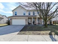 Charming two-story home with brick and siding exterior, covered porch, and attached two-car garage at 1905 Windsor Ln, Danville, IN 46122