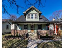 Charming two-story home with updated brickwork, landscaping, and fresh exterior paint at 920 N Chester Ave, Indianapolis, IN 46201