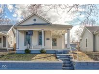 Charming home featuring a welcoming front porch, well-maintained landscaping and inviting curb appeal at 1411 Franklin St, Columbus, IN 47201