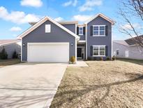 Inviting two-story home with a two-car garage and tidy landscaping at 15138 Silver Charm Dr, Noblesville, IN 46060
