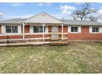 Charming brick ranch home with a welcoming front porch and well-maintained yard at 17 Crestview Dr, Greenwood, IN 46143