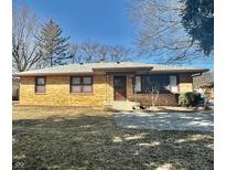 Inviting single-Gathering brick house with a well-manicured lawn and charming details at 6346 Shelby St, Indianapolis, IN 46227
