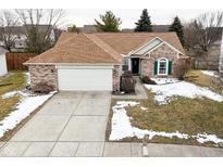 Charming single-Gathering home with a brick facade, attached garage, and well-maintained lawn at 10120 Youngwood Ln, Fishers, IN 46038