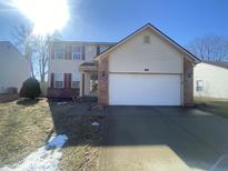 Charming two-story home with a two-car garage, red shutters, and a well-maintained front yard at 12151 Bearsdale Dr, Indianapolis, IN 46235