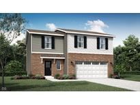 Charming two-story home with brick and siding, complemented by a well-manicured front yard and two car garage at 1585 Ironwood Rd, Greenfield, IN 46140