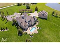 Sprawling estate featuring a backyard swimming pool, guest house, and well-manicured grounds at 2766 S Honey Creek S Rd, Greenwood, IN 46143