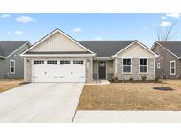 Charming single-story home with stone accents, attached garage and well manicured yard at 1230 Maumee Ct, Greenfield, IN 46140