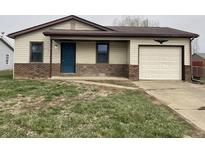 Charming single-story home featuring a brick foundation and a one-car garage at 1280 Ash Ct, Martinsville, IN 46151