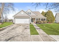 Charming home featuring a manicured lawn and a spacious two-car garage on a sunny day at 1338 Valdosta Pl, Westfield, IN 46074