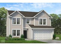 Charming two-story home with a two-car garage, gray siding, and manicured landscaping at 1950 Black Oak Dr, Shelbyville, IN 46176