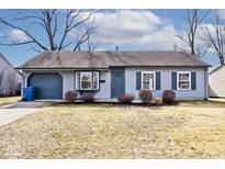 Charming single-story home with a bay window, blue siding, and a cozy, well-maintained front yard at 8139 Laughlin Dr, Indianapolis, IN 46219