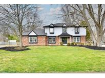 Charming two-story home with a well-maintained lawn and inviting curb appeal at 11708 Rolling Springs Dr, Carmel, IN 46033