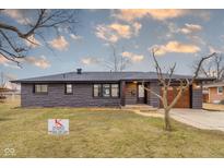 Charming single-story home with stone exterior, updated windows, and attached garage at 2625 15Th St, Columbus, IN 47201