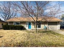 Charming single-story home with a blue front door and attached one car garage at 3144 Norwich Ln, Indianapolis, IN 46224