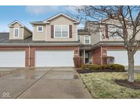 Charming townhome with a two-car garage, brick accents, and inviting curb appeal in a well-kept neighborhood at 5682 Castor Way, Noblesville, IN 46062