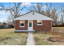 Charming brick home featuring a crisp white trim, a well-maintained walkway, and a cozy front yard at 6104 Gifford St, Indianapolis, IN 46228