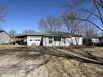 Charming single-story home with a driveway and attached garage, perfect for comfortable living at 130 Merriman Rd, Mooresville, IN 46158