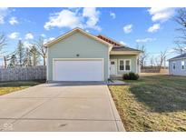 Charming single-Gathering home with an attached garage, driveway, and well-maintained lawn at 2243 E Werges Ave, Indianapolis, IN 46237