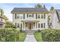 Charming two-story home featuring a covered porch, traditional windows, and a well-maintained front yard at 4305 Central Ave, Indianapolis, IN 46205
