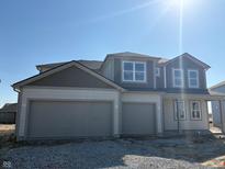 Charming two-story home featuring a two-car garage and neutral color palette at 5546 Tart Blvd, Indianapolis, IN 46239