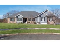 Charming single story home with brick and shake siding, professional landscaping, and a manicured front lawn at 918 Bright Beam Ct, Westfield, IN 46074
