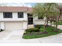 Charming two-story home with well-maintained landscaping and attached two car garage at 9505 Bay Vista W Dr, Indianapolis, IN 46250