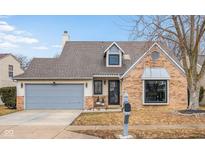 Charming single-Gathering home showcasing a brick facade and a well-manicured front yard at 10540 Bartley Dr, Indianapolis, IN 46236