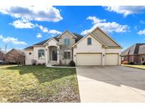 Charming two-story home with a well-maintained yard, arched entry, and attached two-car garage at 1229 Heritage Trl, Franklin, IN 46131