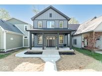 Charming two-story home featuring a covered front porch and modern architectural design at 1234 S Talbott St, Indianapolis, IN 46225