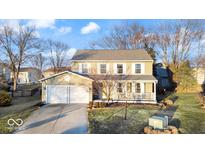 Charming two-story home with a welcoming front porch and attached two-car garage at 12377 Traverse Pl, Fishers, IN 46038