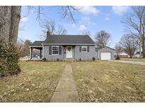 Charming single Gathering home with gray siding, black shutters, and a well-maintained front yard at 23 Greenacre Dr, Brownsburg, IN 46112