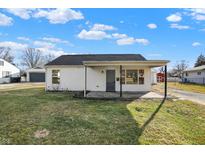Charming single-story home features a covered porch and a well-maintained front yard at 320 Ardmoor Dr, Whiteland, IN 46184