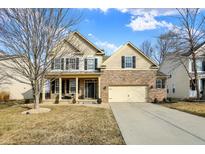 Charming two-story home with a brick and siding exterior at 6126 Golden Eagle Dr, Zionsville, IN 46077