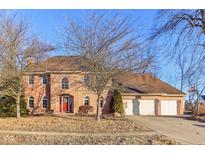 Charming two-story brick home with three-car garage and mature trees in a lovely neighborhood at 6878 Black Oak East Ct, Avon, IN 46123