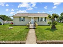 Charming one-story home featuring a well-manicured lawn and inviting walkway at 817 Hamilton St, Lebanon, IN 46052