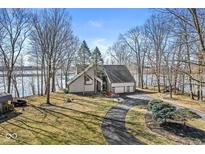 Beautiful two-story home with an attached two car garage and a winding drive at 18 Point Ln, Arcadia, IN 46030